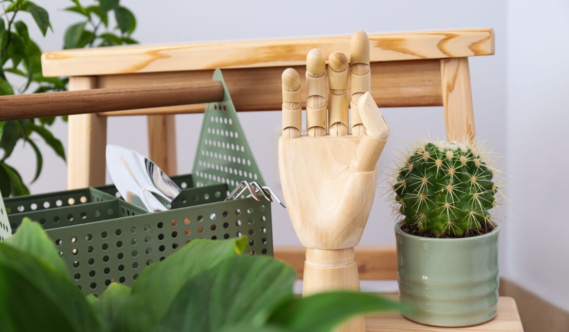 A cozy living room with a Snake Plant in a decorative pot on a wooden coffee table, surrounded by other green houseplants, a grey sofa with a green blanket, and wooden cabinets in the background.